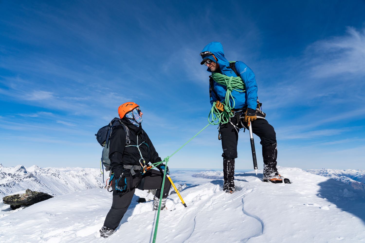 Guided climb summit Single Cone Guide and climber on summit of Single Cone, roped together.